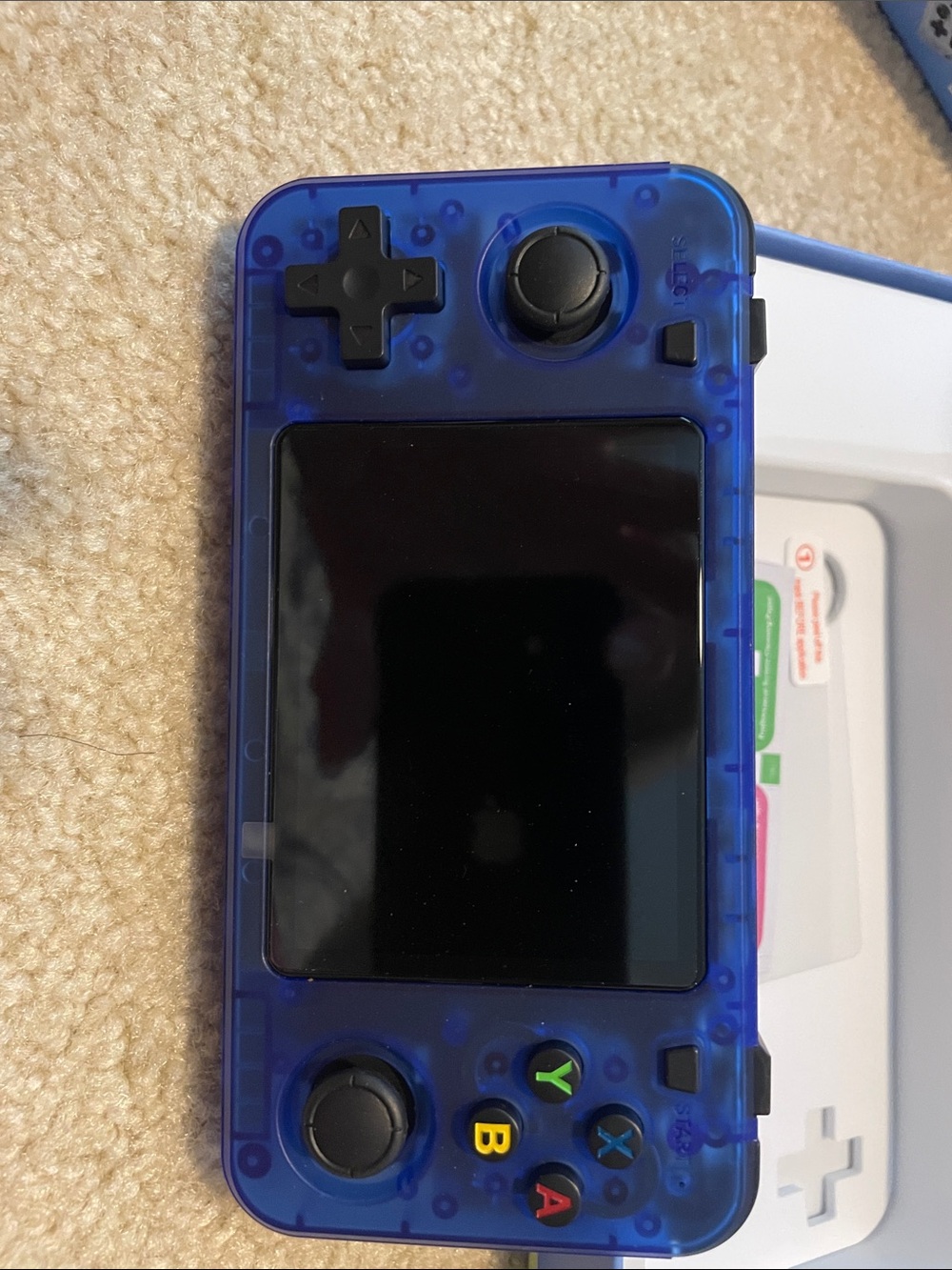 Transparent Blue Handheld Gaming Console with Dual Analog Sticks